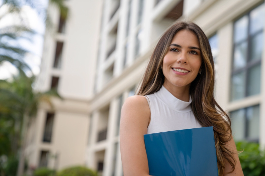 Manager standing outside of a high-rise condo community Manager standing outside of a high-rise condo community